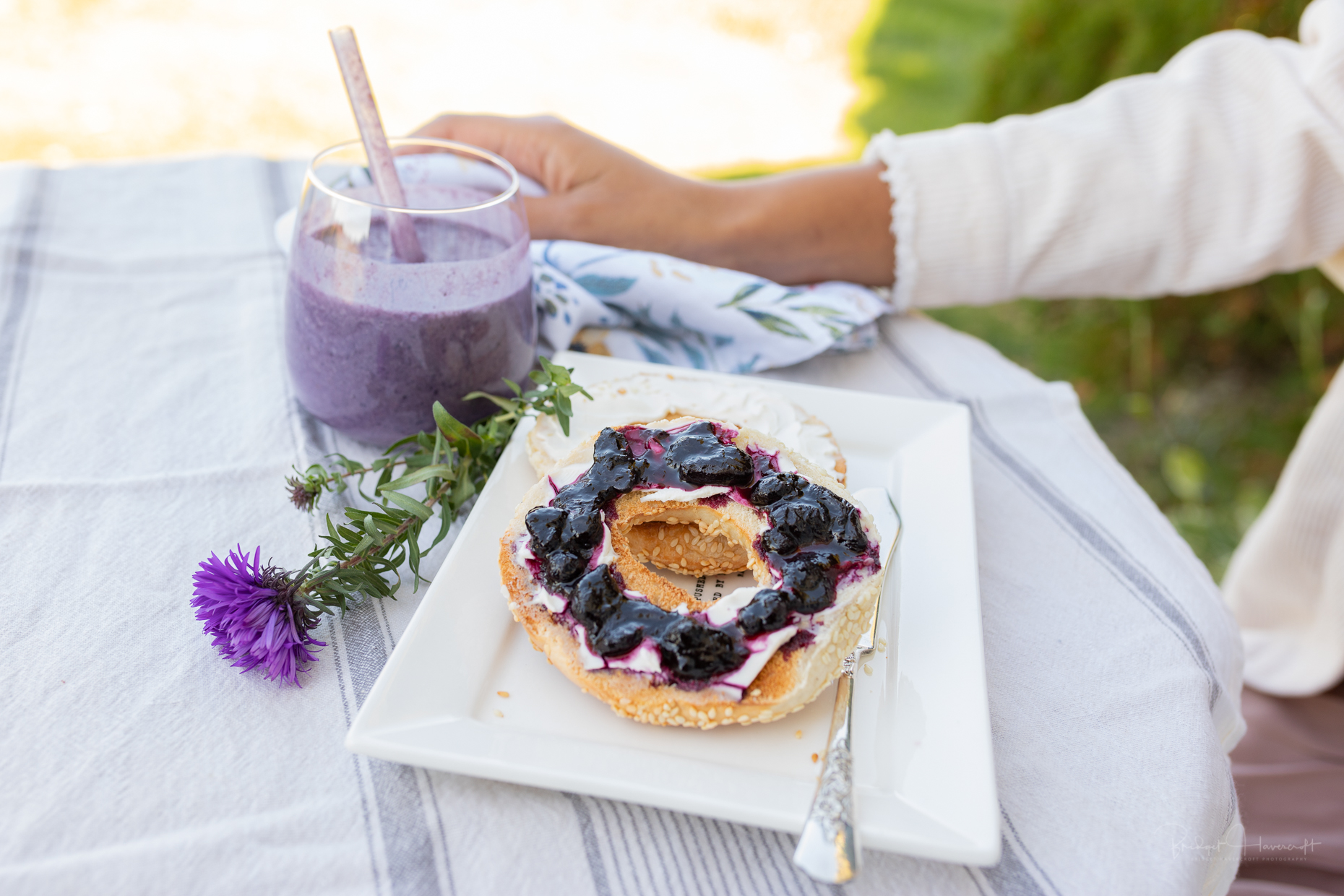 Haskap Highland Berries-Breakfast on the terrace. A delicious kaskap berry smoothie with a cream cheese bagel covered in haskap preserve